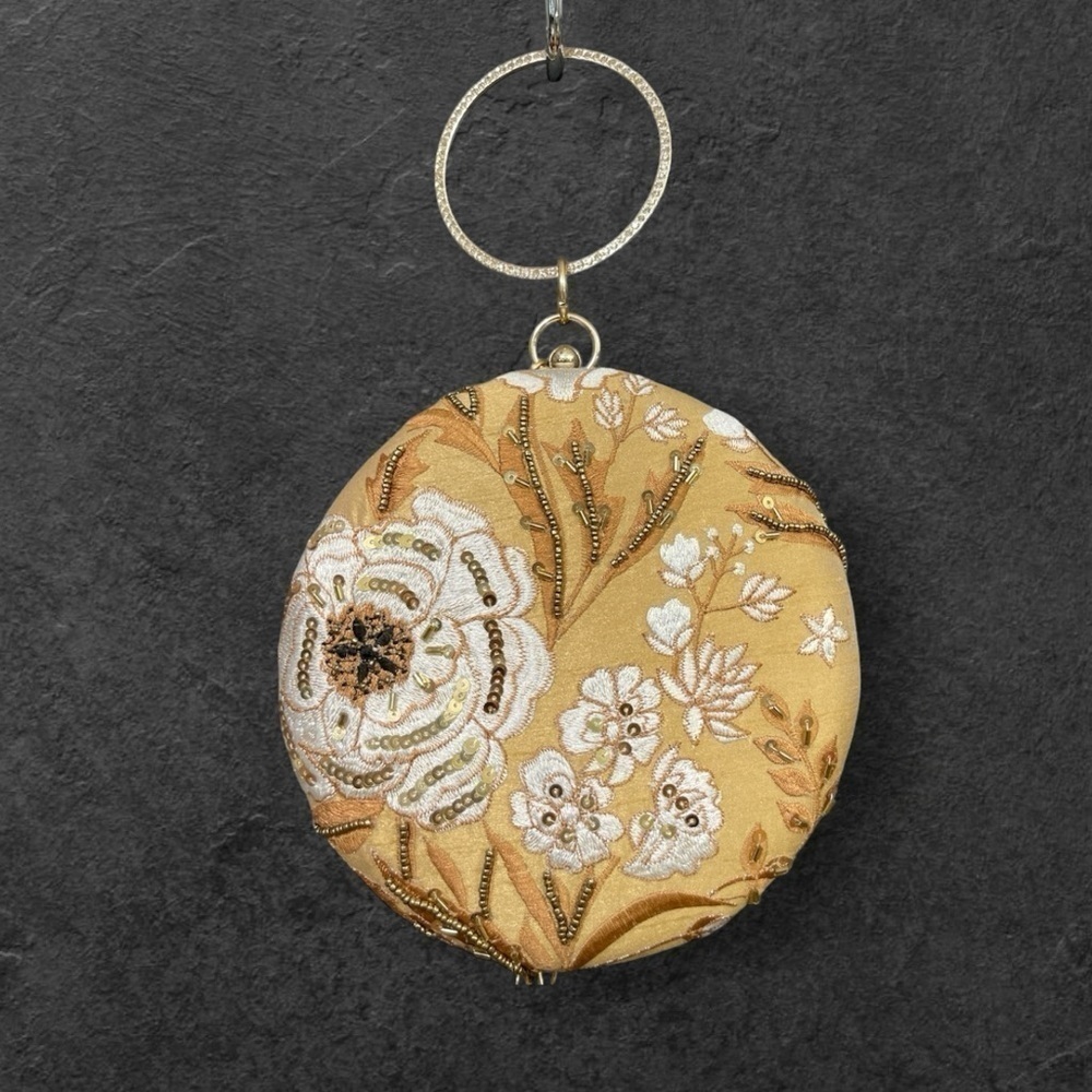 CLUTCHES AND MORE
Beige round floral clutch with sequins and bead work.